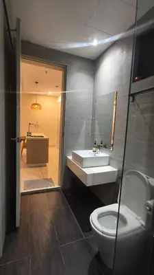 a bathroom with a toilet and a sink and a tub at Trion Kuala Lumpur in Kuala Lumpur