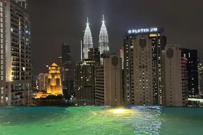 a view of a city skyline at night at Majestic Residence KLCC by Luxe in Gua Sai