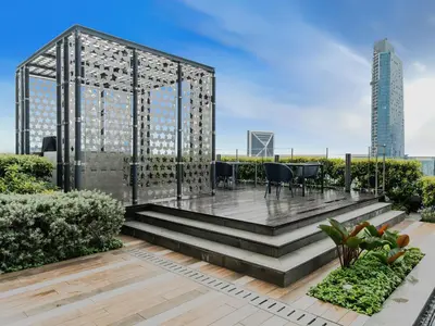 a garden with a gazebo on the roof of a building at Star KLCC Cosy Twin Tower Suite 2-3pax in Kuala Lumpur