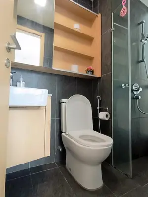 a bathroom with a toilet and a sink and a shower at The Wisma Infinitum KLCC By Kuala Lumpur City in Kuala Lumpur