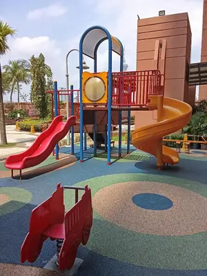 a playground with a slide in a park at Healthy suite At Times Square KL in Kuala Lumpur