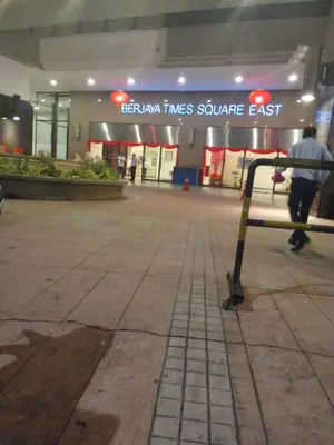 a shopping center with a cart in front of a store at Healthy suite At Times Square KL in Kuala Lumpur