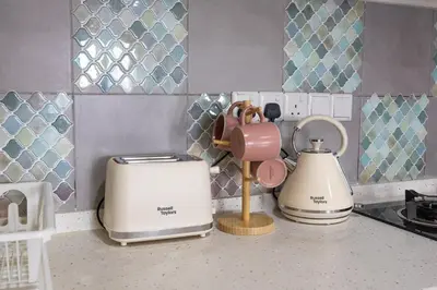 a kitchen counter with two appliances on a counter top at Kuala Lumpur M Vertica Retro 3BR with Car park in Kuala Lumpur