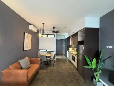 a living room with a couch and a table at Metahome at Scarletz suites KLCC in Kuala Lumpur