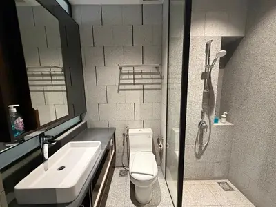 a bathroom with a sink and a toilet and a shower at Metahome at Scarletz suites KLCC in Kuala Lumpur