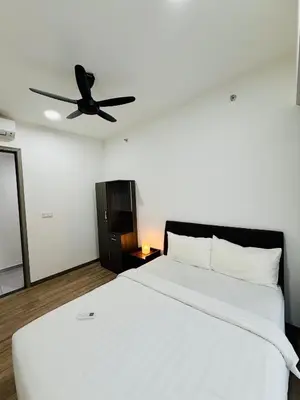 a bedroom with a white bed with a ceiling fan at Agile Bukit Bintang TRX By Glanza Suites in Kuala Lumpur