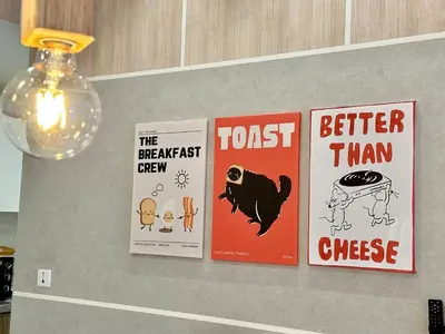 a shelf with four posters on a wall at Robertson 1R1B Pinwu Bkt Bintang|Chinatown|LRT in Kuala Lumpur