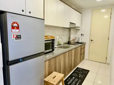 a white kitchen with a refrigerator and a sink at Robertson 1R1B Pinwu Bkt Bintang|Chinatown|LRT in Kuala Lumpur