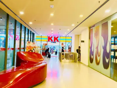 a store with a red chair in the middle of a hallway at Mercu Summer suites KLCC by Classy in Kuala Lumpur