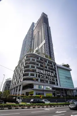 a tall building with a sign on the front of it at trion in Kuala Lumpur