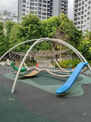 a playground with a slide in a park at Agile Bukit Bintang Sleepy in Kuala Lumpur