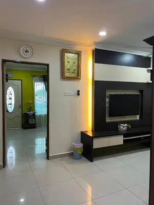 a living room with a flat screen tv on a wall at Gombak Fatin Homestay in Kuala Lumpur