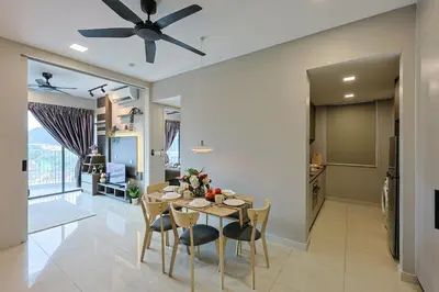 a dining room and kitchen with a table and chairs at Elegant Skyline Suite # Datum Jelatek near KLCC in Kampong Datok Keramat