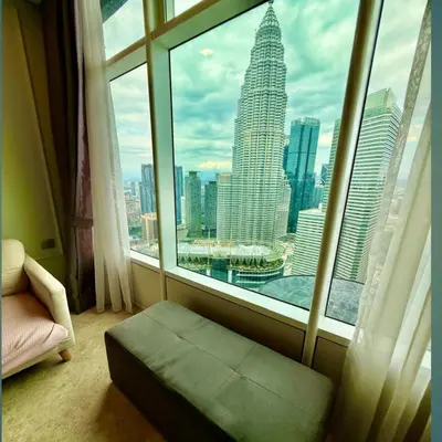 a room with a window with a view of the city at Sky suites klcc by sky view in Kuala Lumpur
