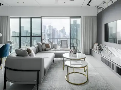 a living room with a couch and a table at Prime Location KLCC - next to MRT in Kuala Lumpur