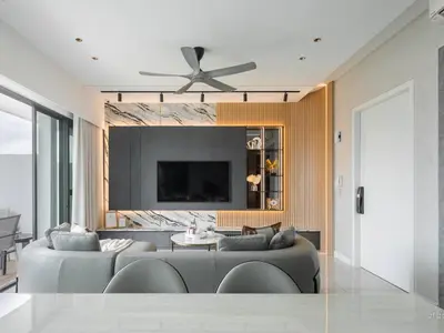 a living room with a couch and a ceiling fan at Prime Location KLCC - next to MRT in Kuala Lumpur