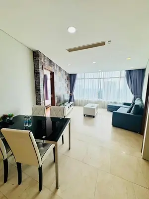 a living room with a table and chairs and a couch at Vortex suites Near Klcc By I&J in Kuala Lumpur