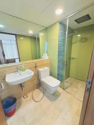 a bathroom with a toilet and a sink and a shower at Vortex suites Near Klcc By I&J in Kuala Lumpur