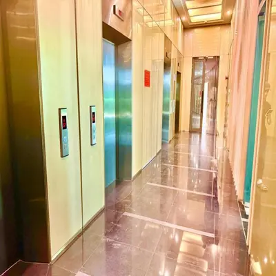 a hallway of an office building with glass doors at sky suites by klcc in Kuala Lumpur