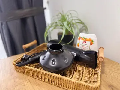 a wicker basket with a tea kettle on a table at 3 Bedrooms KLCC View PlazaRah,Kg Baru next to Rembayung in Kuala Lumpur