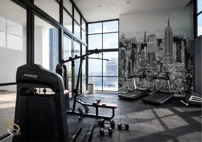 a gym with a view of a city at LUXORA SUITE's REIZZ RESIDENCE in Kuala Lumpur