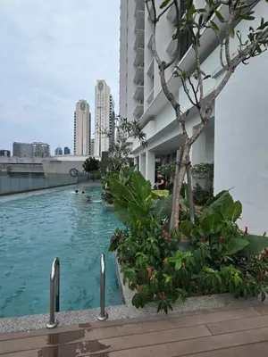 a swimming pool in the middle of a building at Kuala Lumpur Suites Quill in Kuala Lumpur