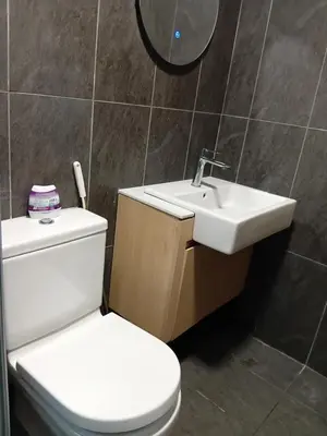 a bathroom with a white toilet and a sink at Infinitum suites KLCC Sky Pool by EXA in Kuala Lumpur