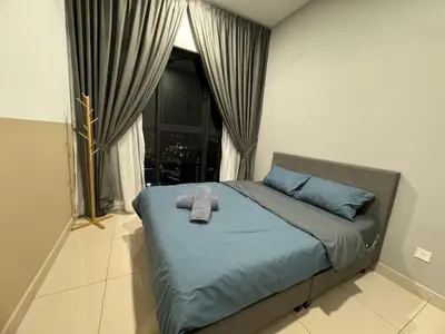 a bed with a stuffed animal on it in a bedroom at TRION KL, Jalan Chan Sow Lin, Kuala Lumpur in Kuala Lumpur