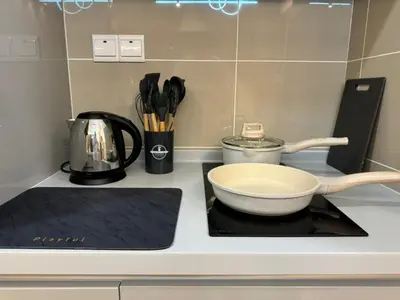 a kitchen counter with a bowl on a cutting board at TRION KL, Jalan Chan Sow Lin, Kuala Lumpur in Kuala Lumpur