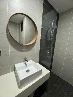 a bathroom with a sink and a mirror at TRION KL, Jalan Chan Sow Lin, Kuala Lumpur in Kuala Lumpur