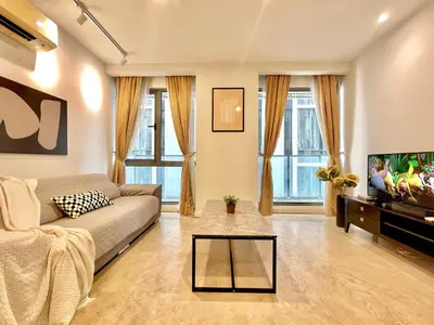 a living room with a couch and a tv at Fairlane Residence near Bukit Bintang KL in Kuala Lumpur