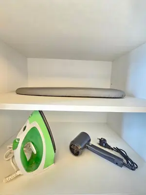 a shelf with a hammer and a toy on it at Cozy Suites 2 to 5pax near Sri Hartamas Mont Kiara in Kuala Lumpur