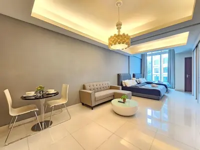 a living room with a couch and a table at Cozy Suites 2 to 5pax near Sri Hartamas Mont Kiara in Kuala Lumpur