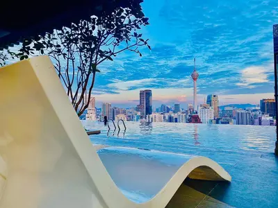a swimming pool with a view of a city skyline at Axon Residence KL Luxury Bukit Bintang in Kuala Lumpur