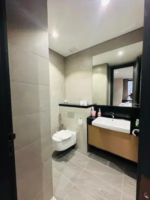 a bathroom with a sink and a toilet and a mirror at City towen klcc by TTR in Kuala Lumpur