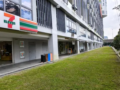 a building with a green lawn in front of it at 02 Kuala Lumpur KL Mid Valley The Garden 9Seputeh Vivo Soho 4PAX in Kuala Lumpur