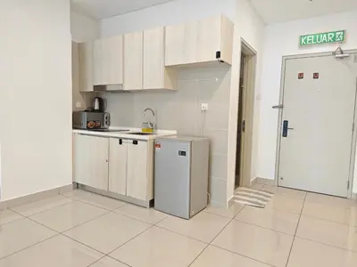 an empty kitchen with a refrigerator and a door at 02 Kuala Lumpur KL Mid Valley The Garden 9Seputeh Vivo Soho 4PAX in Kuala Lumpur