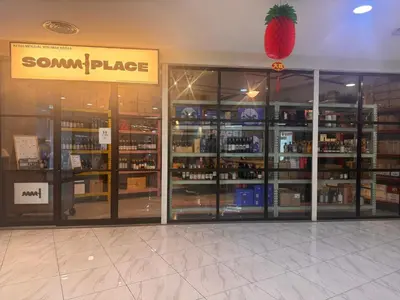 a store front with glass doors and a strawberry on the ceiling at The luxe klcc by jaurami stay in Kuala Lumpur