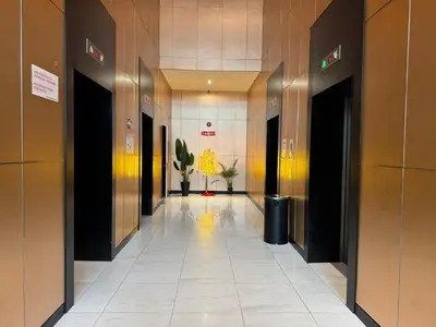 a hallway with elevators in a building at The luxe klcc by jaurami stay in Kuala Lumpur