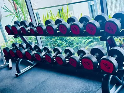 a bunch of wine bottles on a rack in a gym at The luxe klcc by jaurami stay in Kuala Lumpur