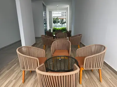 a group of chairs and a table in a room at The luxe klcc by jaurami stay in Kuala Lumpur