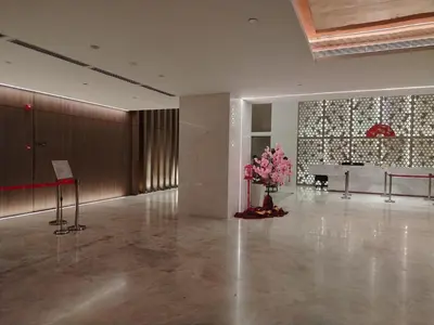 a large room with a vase of flowers on the floor at NEO Quill Residences klcc in Kuala Lumpur