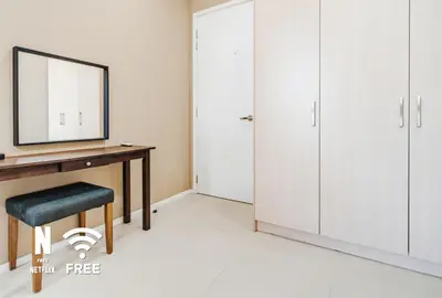 a dressing room with a desk and a mirror at Arcoris SOHO Mont Kiara , Stylish 1 Bedroom Retreat in Kuala Lumpur