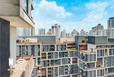 a view of a city skyline with tall buildings at Arcoris SOHO Mont Kiara , Stylish 1 Bedroom Retreat in Kuala Lumpur