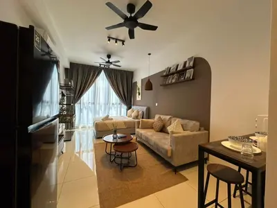 a living room with a couch and a ceiling fan at service apartment majestic city center klcc in Kuala Lumpur