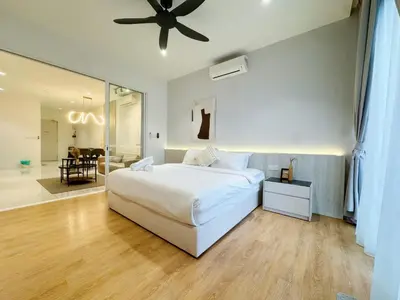 a bedroom with a white bed and a ceiling fan at Veone Hotel Kuala Lumpur in Kuala Lumpur