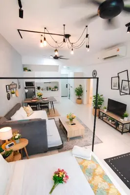 a living room with a couch and a table at Future Star Chamber Residence in Kuala Lumpur