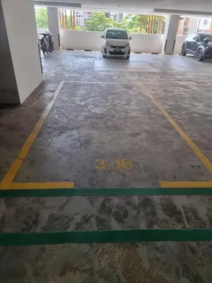 a parking lot with a car parked in it at Awani3 Homestay, Setapak, KL in Kuala Lumpur