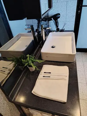 a counter with two sinks in a bathroom at The Times Square KLCC by Bukit Bintang in Kuala Lumpur