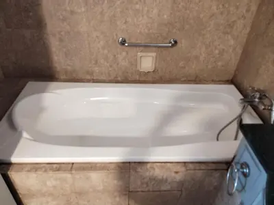 a white bath tub in a bathroom with a counter at The Times Square KLCC by Bukit Bintang in Kuala Lumpur